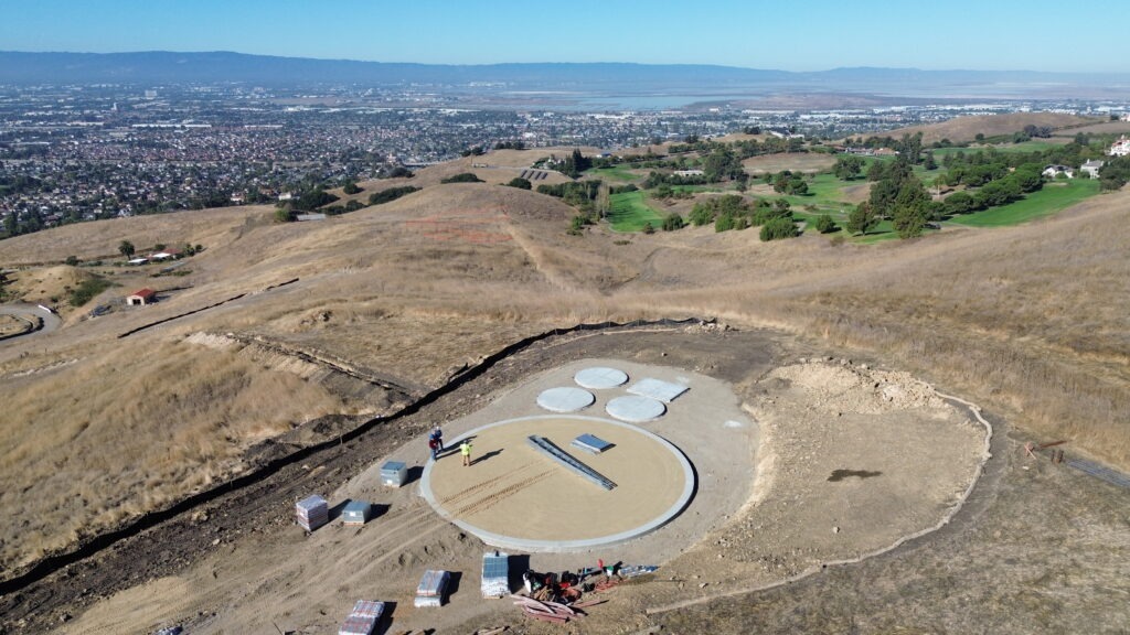All Access Construction completing concrete outer ring pour for large hillside water tank foundation Milpitas