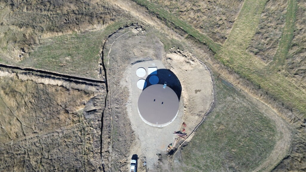 All Access Construction top-down drone shot of completed Milpitas water tank foundation and concrete access pads