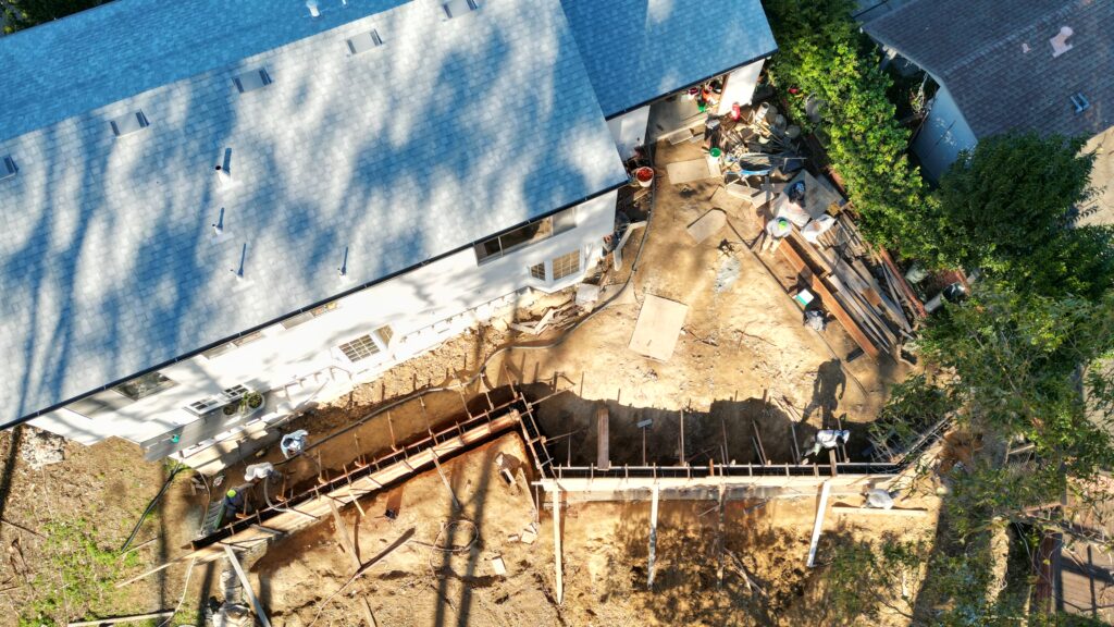 All Access Construction drone view showing San Rafael slope stabilization and wall build