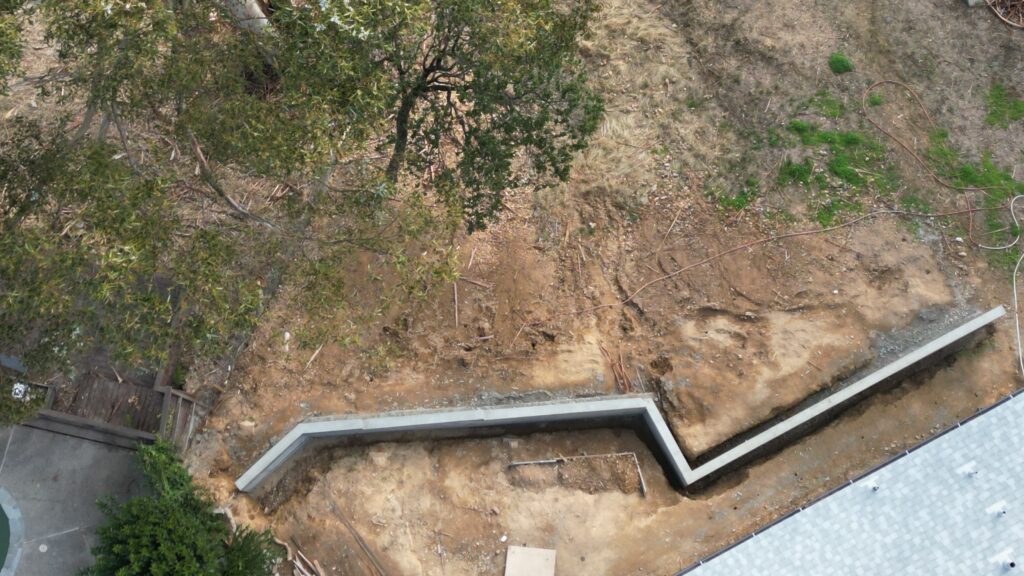 All Access Construction drone view of San Rafael concrete wall and slope stabilization