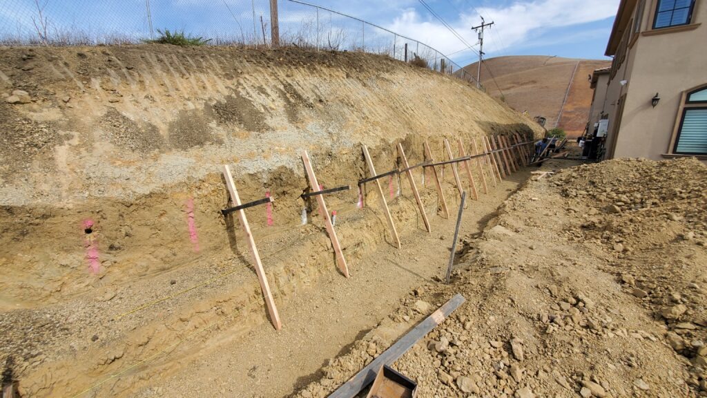 Retaining wall layout and batter board setup in Milpitas CA for a 5 foot high concrete retaining wall