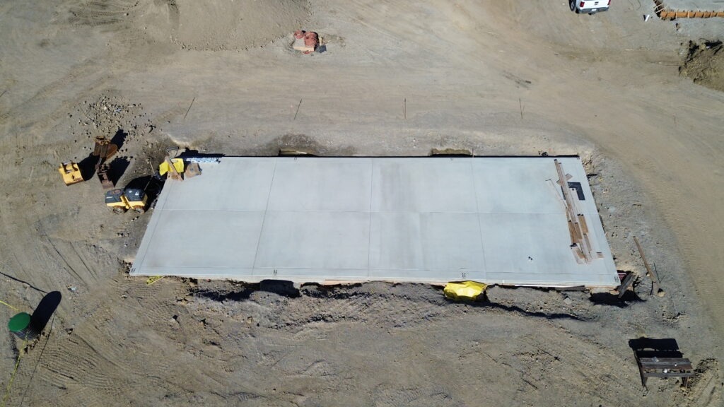 Finished carport foundation slab in Milpitas built with shear footings and structural rebar.