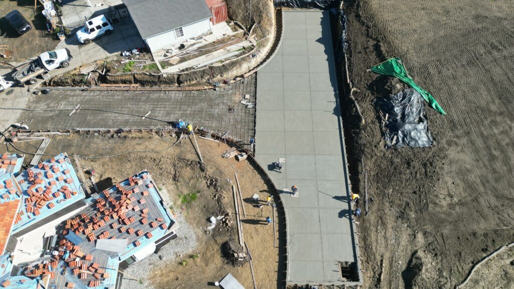 All Access Construction Milpitas hillside driveway concrete installation with panoramic valley view