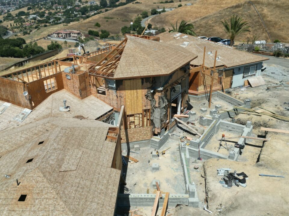 Drone shot of structural concrete foundation progress and grade beam rebuild for Milpitas hillside home