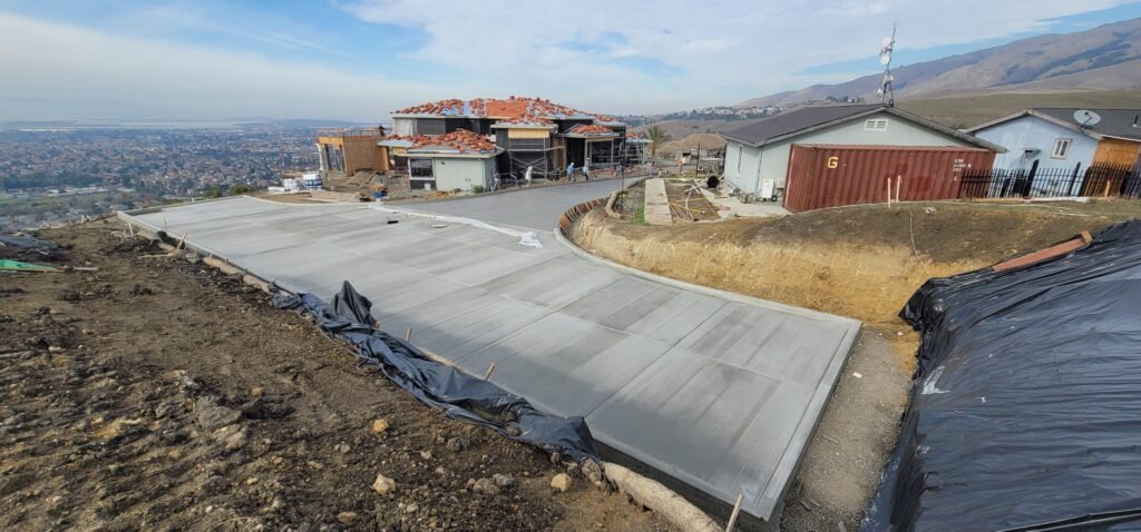 All Access Construction Milpitas hillside driveway concrete installation with panoramic valley view
