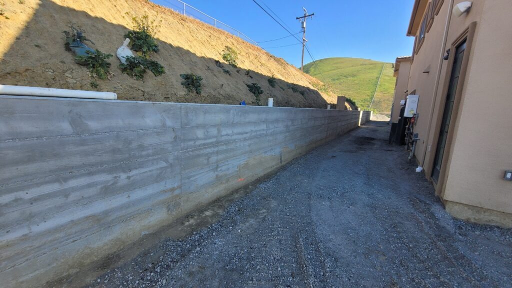 Finished concrete retaining wall in a side yard in Milpitas CA Santa Clara County