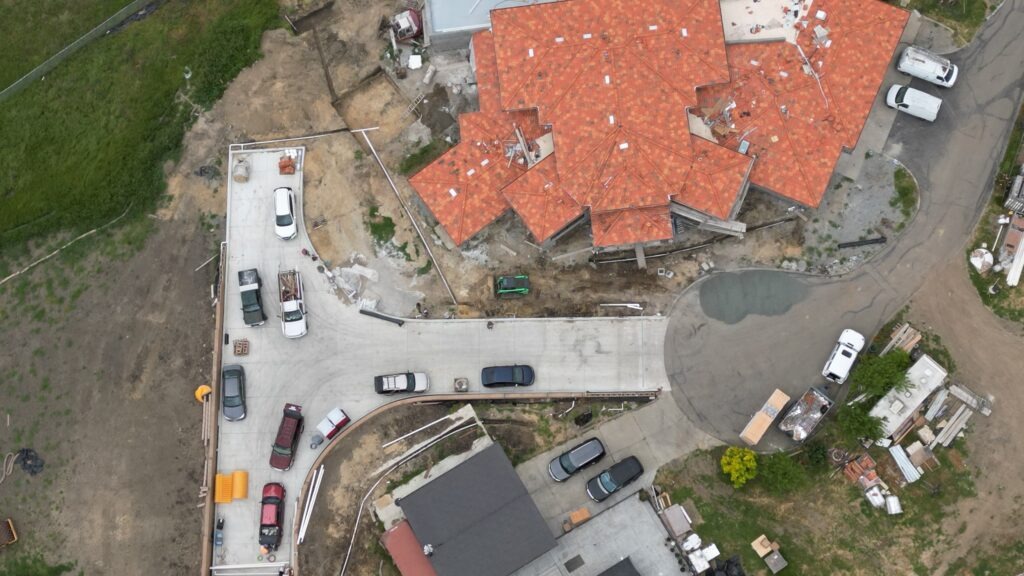 All Access Construction long concrete driveway installation on Milpitas hillside project