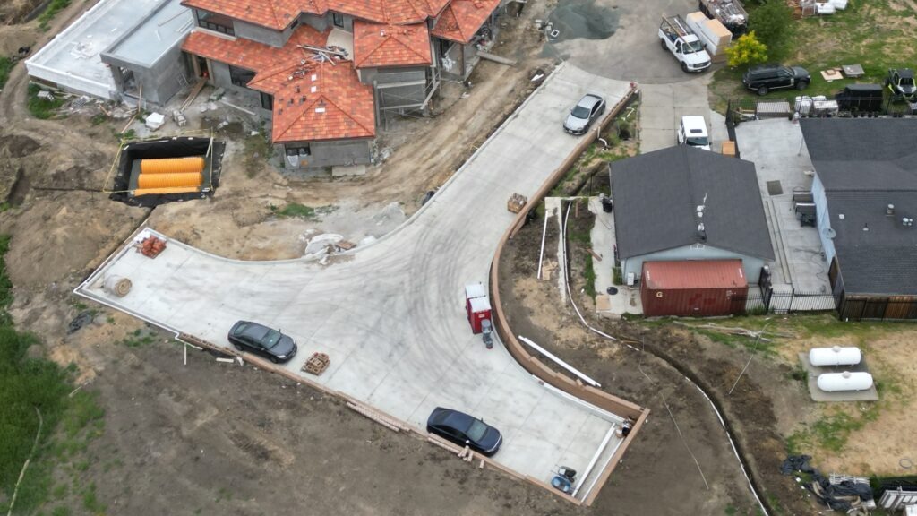 All Access Construction final grade and concrete driveway finish on Milpitas hillside