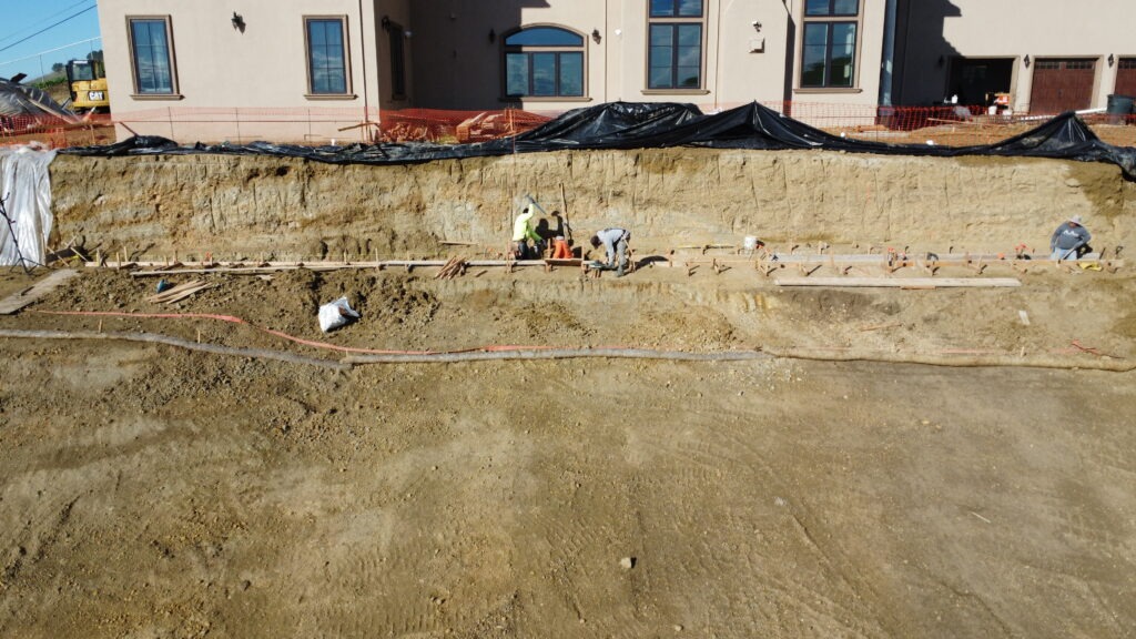 Drone view of formwork for a 2x2 concrete grade beam in Milpitas California structural foundation work