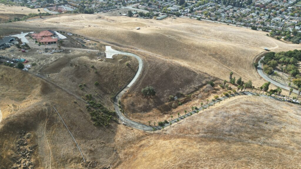 Milpitas hillside concrete foundation with crew installing rebar for grade beam and drilled piers, All Access Construction structural foundation work.