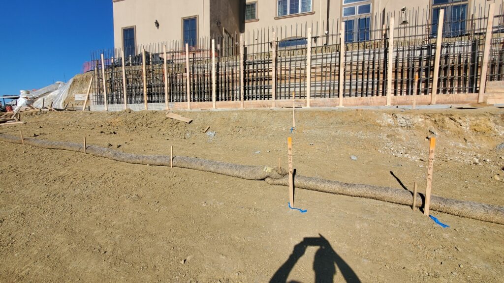 Concrete retaining wall footing layout on steep hillside in Milpitas California as part of longest wall build