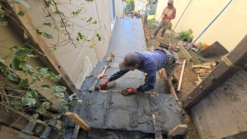 All Access Construction – finishing fresh concrete on Belmont stair project