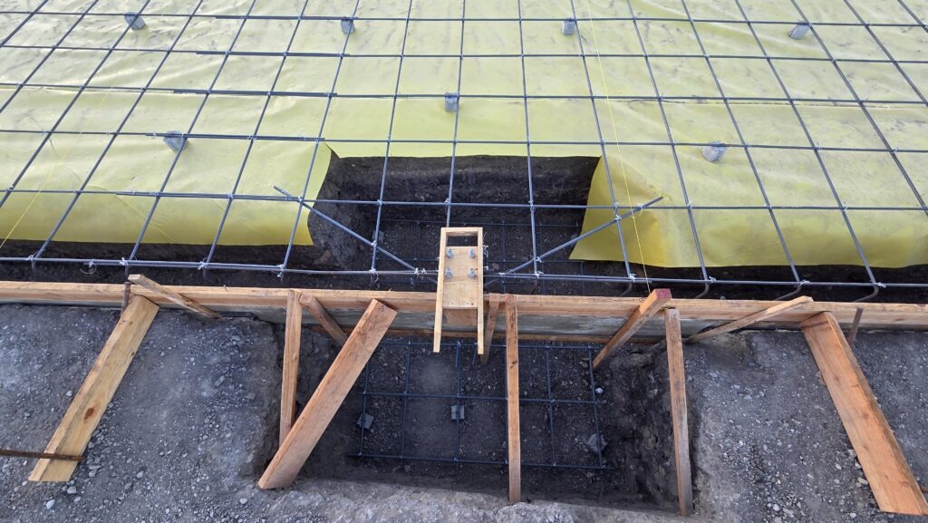 Drone view of Milpitas AG shed slab prep with vapor barrier and rebar