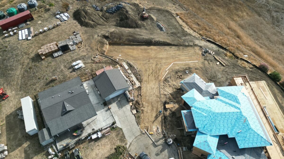 Drone view of grading preparation before concrete driveway construction in Milpitas