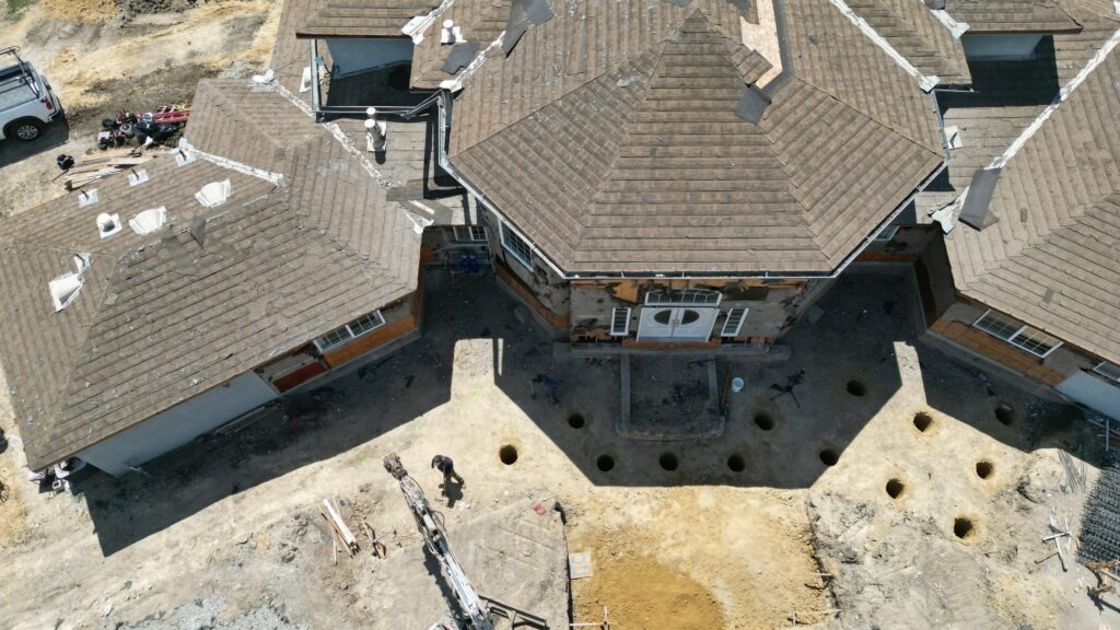 Drone view showing pier layout and excavation for structural grade beam foundation in Milpitas – Milpitas