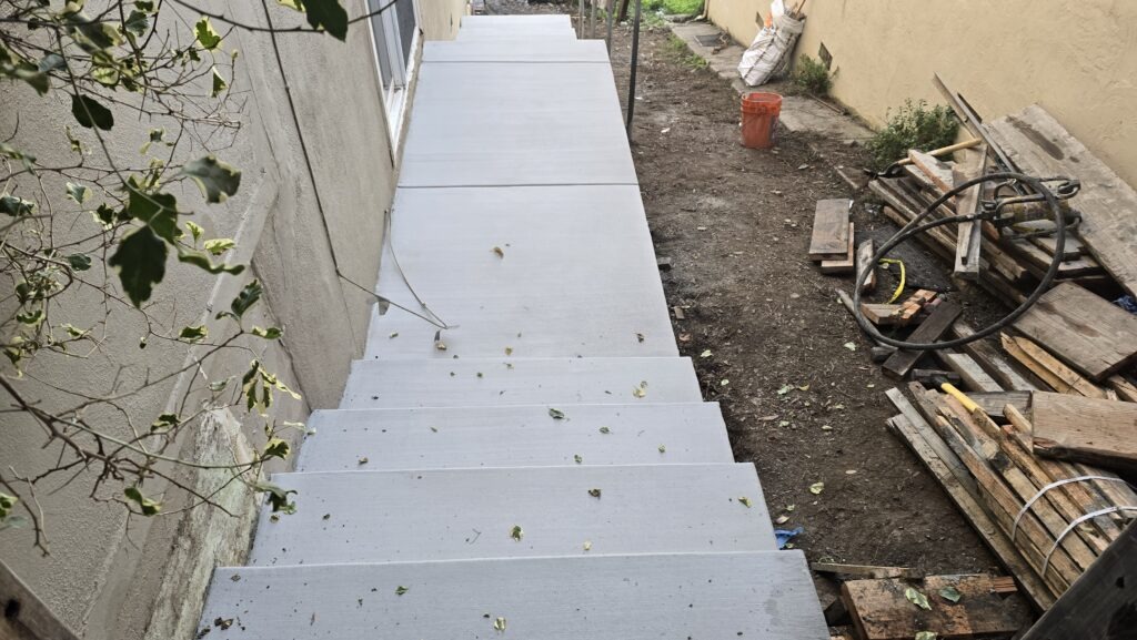 All Access Construction – newly poured Belmont concrete staircase with clean broom finish