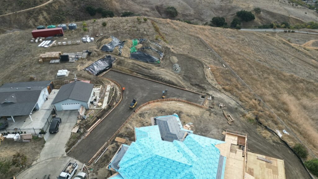 Grading and formwork setup for hillside concrete driveway in Milpitas