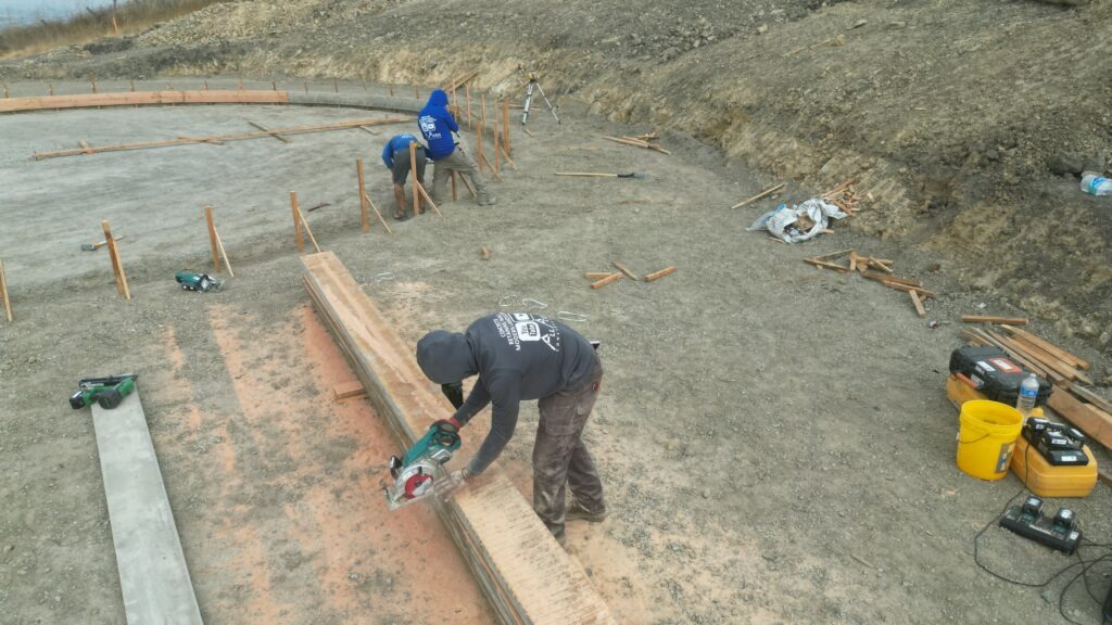 All Access Construction cutting and setting curved forms for 50-foot concrete water tank foundation in Milpitas