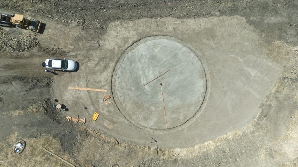 All Access Construction leveling and laying out circular water tank foundation on hillside property in Milpitas