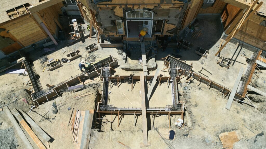Installed concrete piers supporting new structural grade beam foundation by All Access Construction – Milpitas