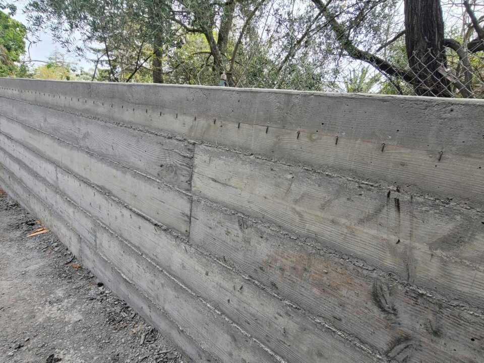 Close-up of board-form concrete texture on new Walnut Creek retaining wall built by All Access Construction