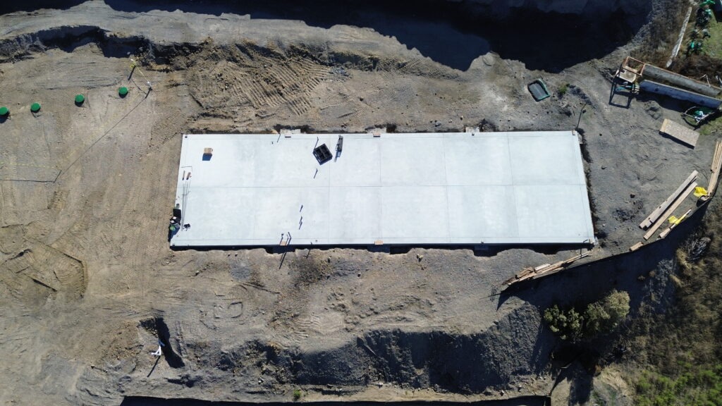 Finished agricultural shed concrete foundation in Milpitas with hillside views