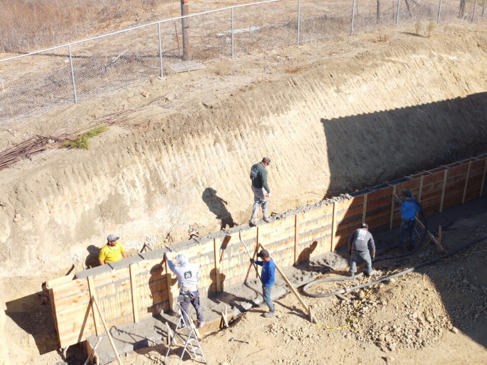 Drone view of retaining wall construction behind home in Milpitas CA Santa Clara County