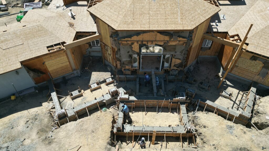 Formwork and concrete staging for structural grade beam rebuild at Milpitas hillside home